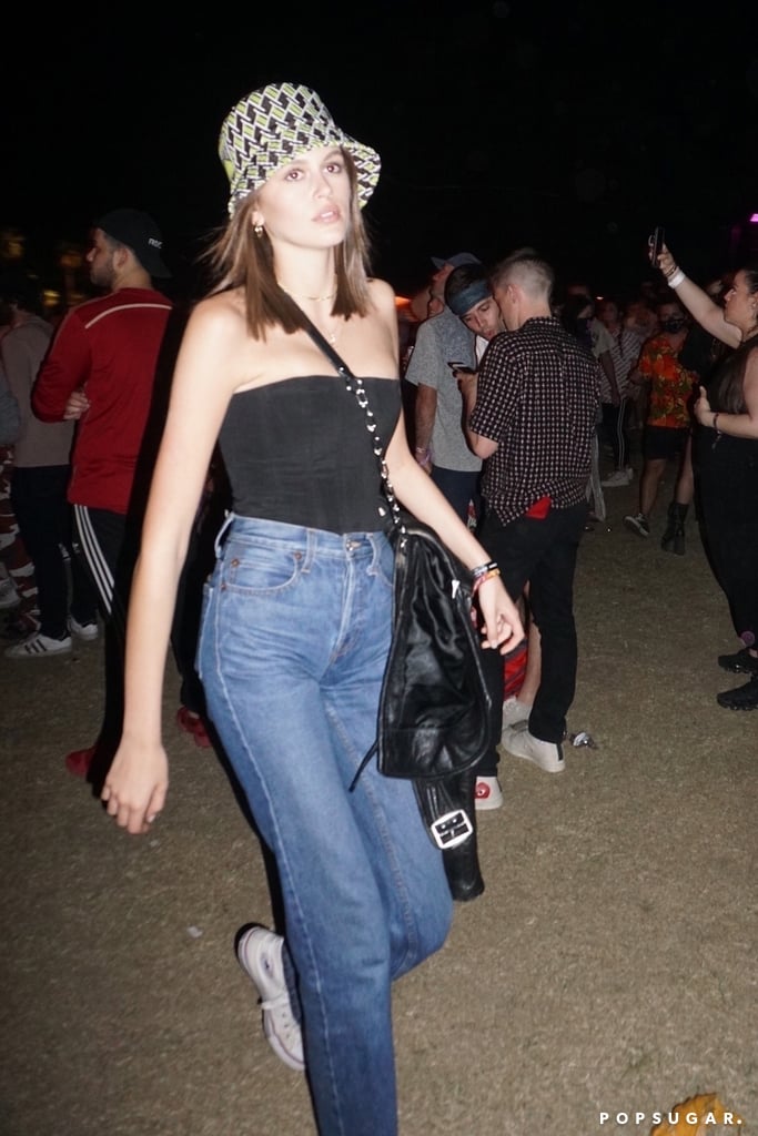 Kaia Gerber Jeans and Tube Top With Bucket Hat at Coachella