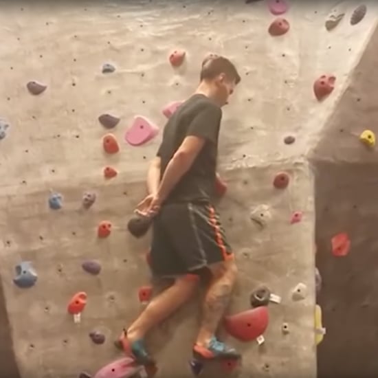Man Rock-Climbing With No Hands