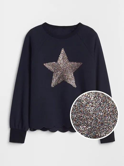 A  Scalloped Graphic Sweater ($40) will help any kid shine extra bright for New Year's Eve and beyond.