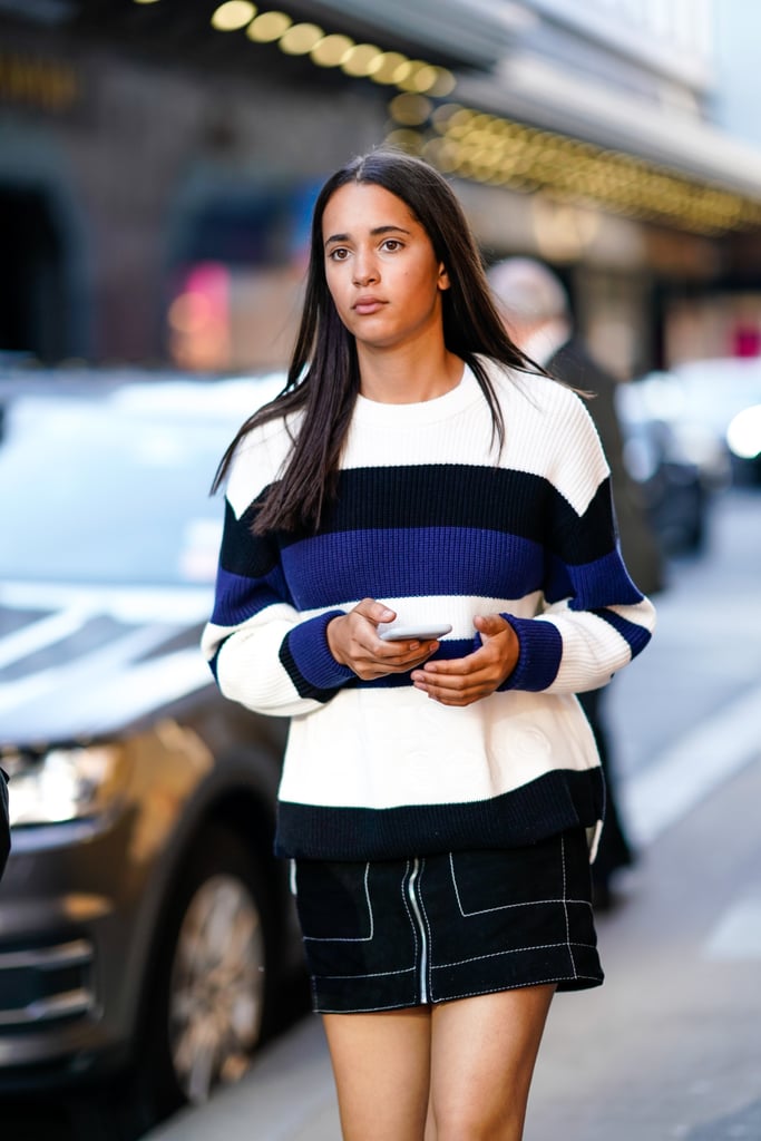 A colour-block sweater is the perfect way to enhance a top-stitch miniskirt.