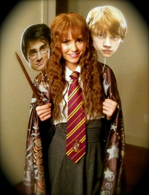 Nina Dobrev dressed as Hermione Granger in 2011, along with cutouts of her pals, Harry Potter and Ron Weasley.