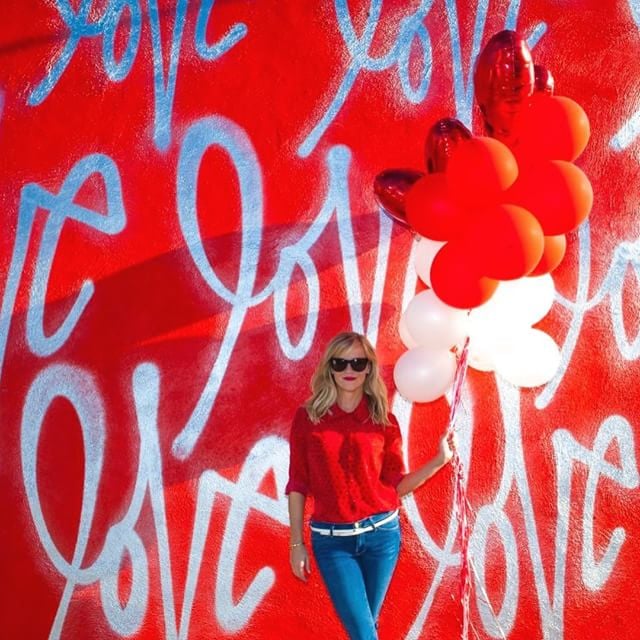 She posed in front of this vibrant backdrop with a handful of balloons, because who wouldn't?
