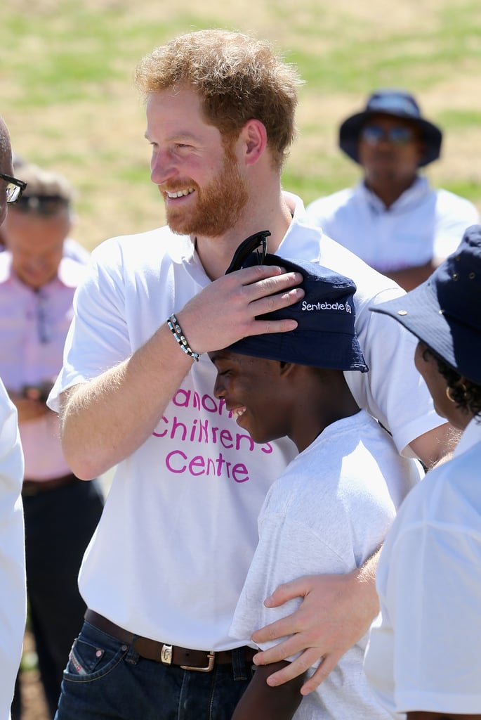 Harry hugged a young boy during the opening of Lesotho's new Mamohato Children's Centre in 2015.