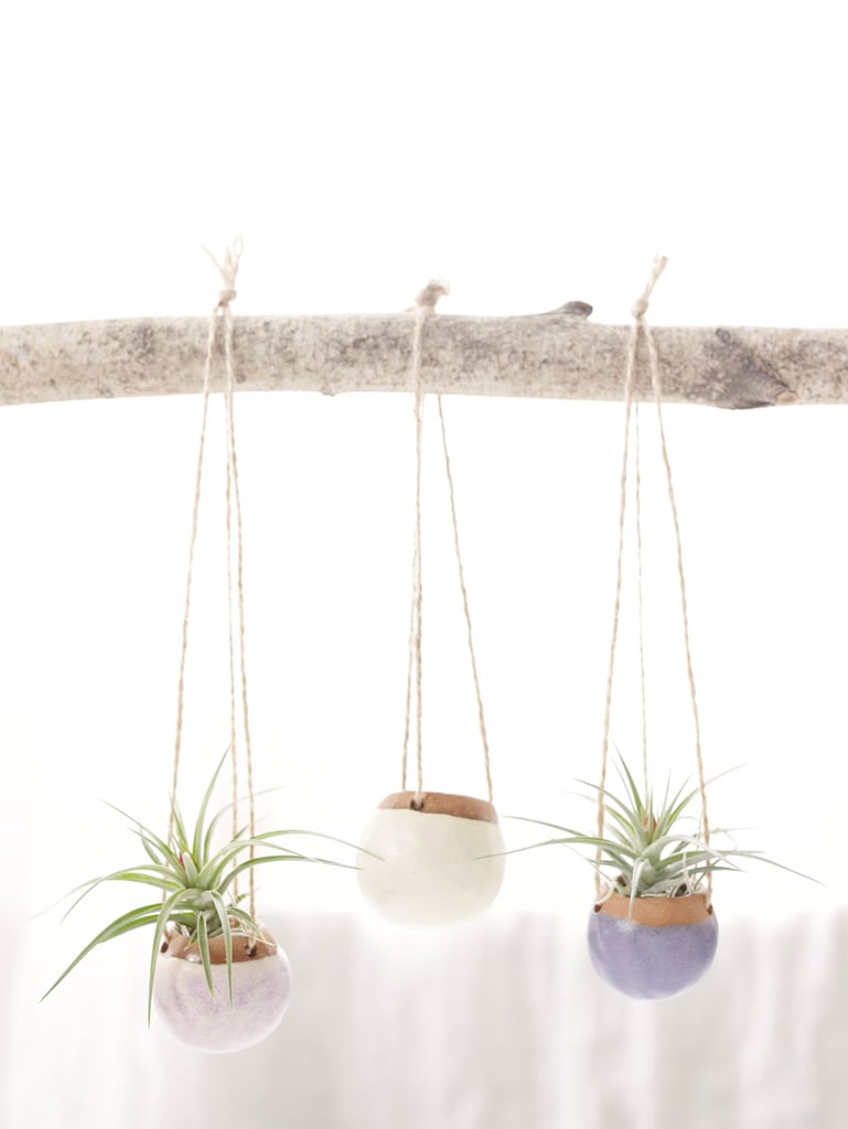 This is the year I promise to keep plants alive, but I'm convinced the only thing that will help are planters like this sweet set of three ($60) in pretty colors. 
— LM