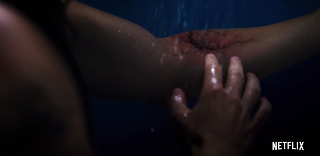When the trailer checks in with Billy, he's not only living it up as a lifeguard — strutting around shirtless, flirting with a few different girls — but there's also a shot of him in the shower. He has a deeply troubled look on his face and we soon see why: there appears to be some kind of red and black growth blossoming on his left forearm. 
So, what could this mean? The poster and previous teasers for the season included rat imagery and footage of rats running through a warehouse. Rats are known for carrying disease, right? What if the rats living underground in Hawkins got into those tunnels that Hopper and the kids were wandering around in under the pumpkin patch in season two and are now carrying an infectious, Upside Down-borne illness? The infection on his arm is in the same red and black shades as those gross, slimy vines that are all over the Upside Down, so it checks out.
Obviously, we can't be sure of how the rats came in contact with Billy, but it wouldn't be that hard to imagine they somehow spread the disease (if it IS a disease) to the pool.