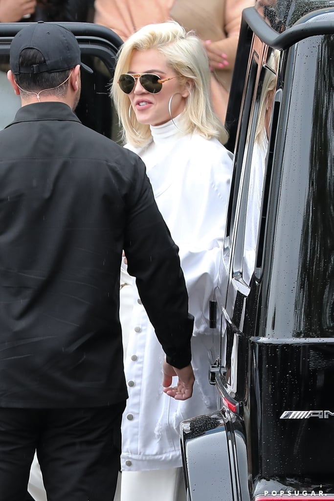 Tristan Thompson, who? Khloé Kardashian appeared to be in good spirits when she stepped out in Calabasas, CA, following her split from the 27-year-old Cleveland Cavaliers player on Tuesday. Dressed in all white, the 34-year-old reality TV star flashed a few smiles as she arrived at brother-in-law Kanye West's office. 
Earlier that day, news broke that Khloé and Tristan had broken up again after he reportedly cheated on her with Kylie Jenner's BFF, Jordyn Woods. According to multiple outlets, including TMZ and Us Weekly, Tristan and Jordyn were allegedly "making out" and "all over each other" at a party on Sunday. Jordyn has been a friend of the Kardashian-Jenners for years now and previously modelled for Khloé's Good American clothing line. "Khloé loved Jordyn before this," a source told Us Weekly. "This is completely shocking to Khloé's family." Another source told People the family is "beyond angry and disgusted." Khloé's BFF, Malika Haqq, also commented on a post referring to the split, writing, "STRONG FACTS." 
Khloé and Tristan first got together in 2016, but their relationship hit a major rough match in April 2018 after photos and videos surfaced of him cheating on Khloé with multiple women. Around the same time, the couple welcomed their first child together, daughter True, and by May 2018, they were back together. Only time will tell what happens between Khloé and Tristan, but things aren't looking so good.
