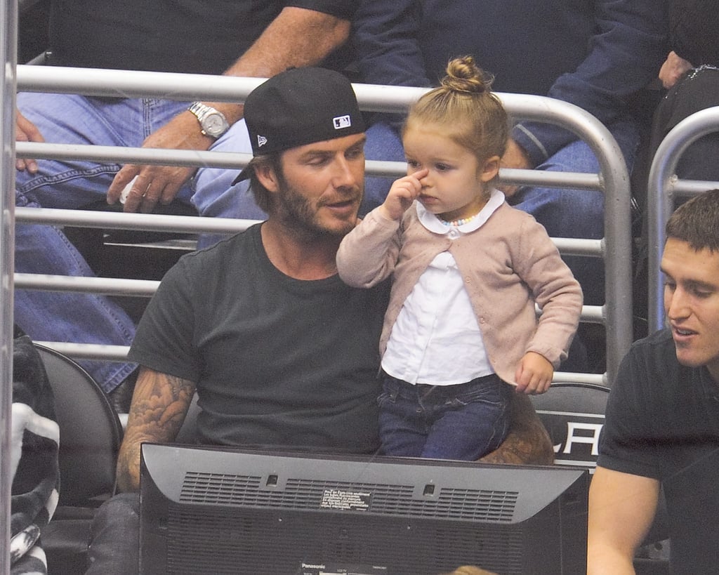 David held little Harper while they watched an LA Kings hockey game in October 2013.