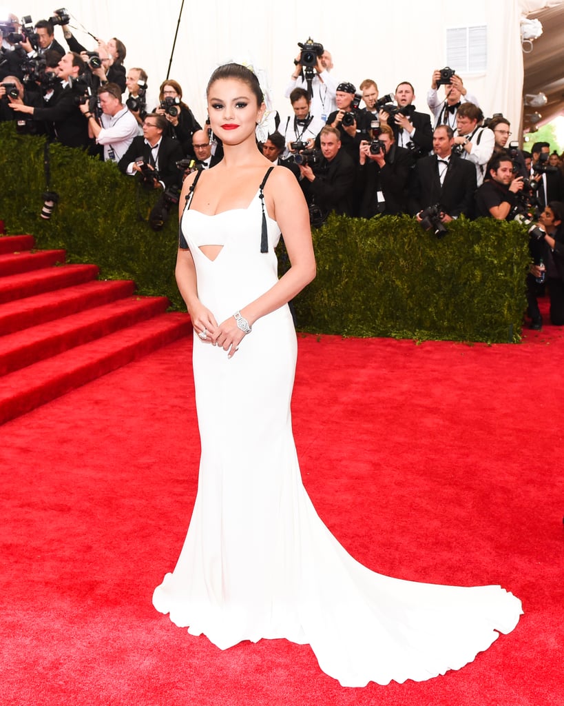 In 2015, Selena attended the Met Ball dressed in Vera Wang. Her monochrome outfit came complete with a cutout and a low back, but Selena held her head high, putting the costume elements on display.