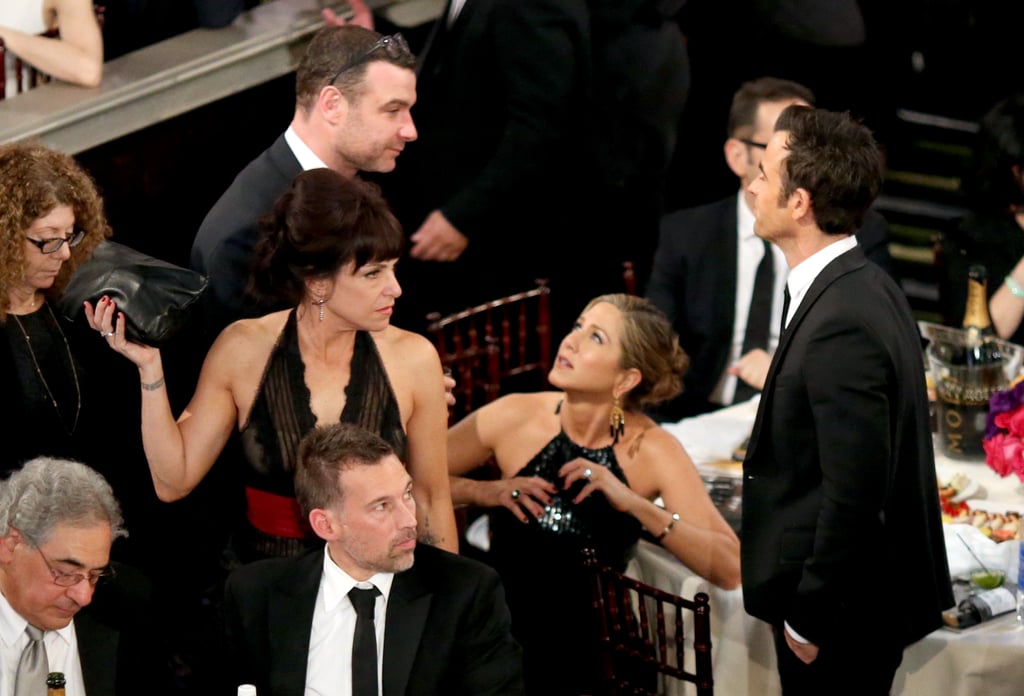 Jennifer Aniston and Justin Theroux hung out during a commercial break. See Liev Schreiber at their table, too?