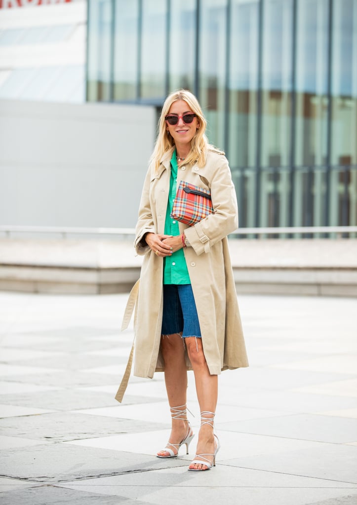 Style Your Denim Shorts With a Button-Down Blouse, Trench Coat, and Lace-Up Heels