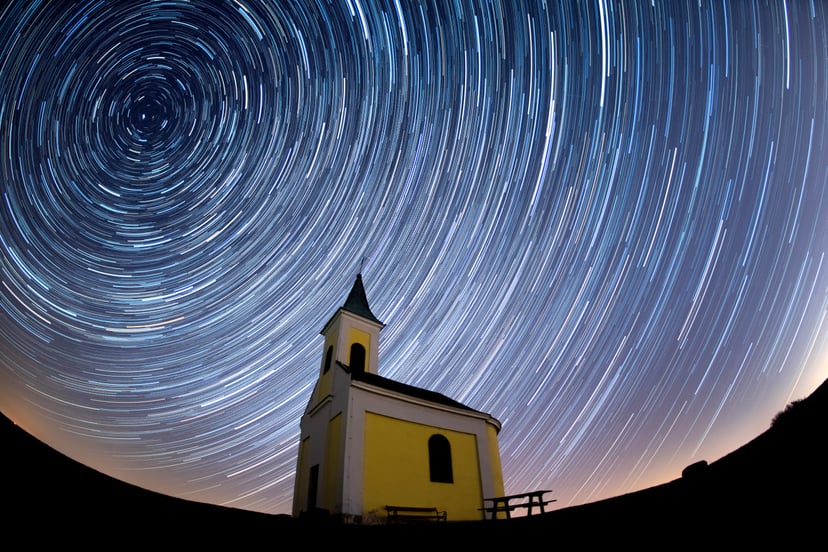 NIEDERHOLLABRUNN, AUSTRIA - APRIL 21: (EDITORS NOTE: Multiple exposures were combined to produce this image.) Startrails are seen during the Lyrids meteor shower over Michaelskapelle on April 21, 2020 in Niederhollabrunn, Austria. The clear skies created 