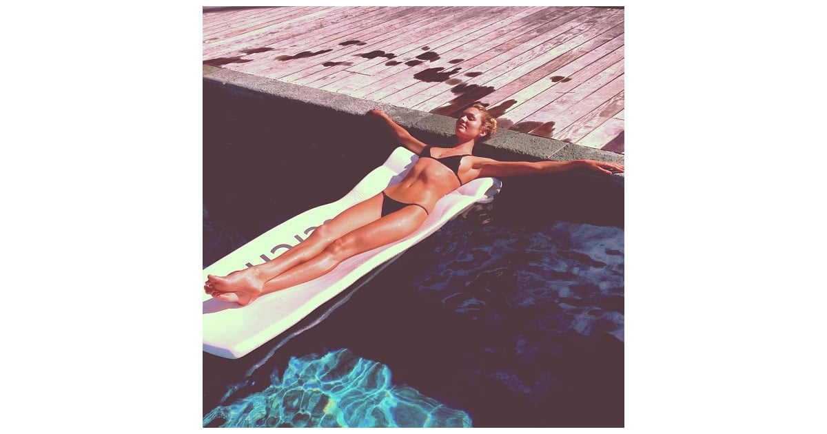 Candice Swanepoel Relaxed On A Raft During A Day At The Pool Celebrity Vacation Pictures 2013