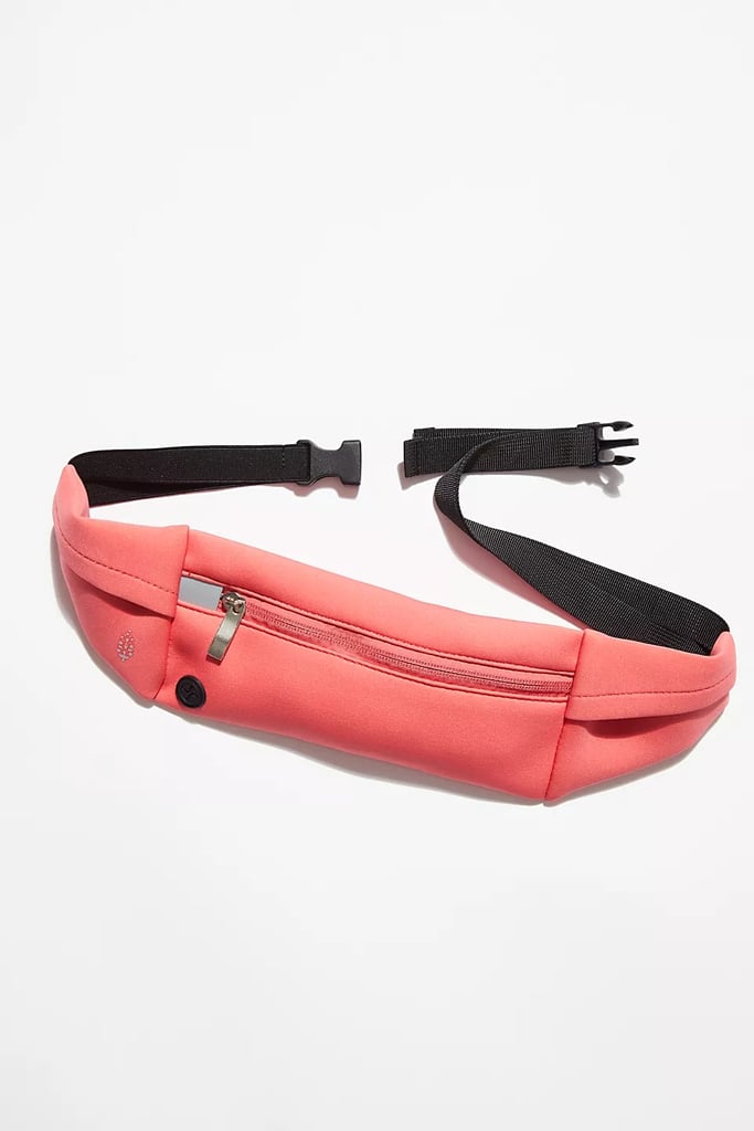 FP Movement Runner Sling ($28)
It's always a great feat to find a functional belt bag that stays put during a run or other workouts, but this design, available in six colors and two adjustable sizing models, gets great reviews. The slim pocket won't feel bulky on the go but still fits all your essentials.