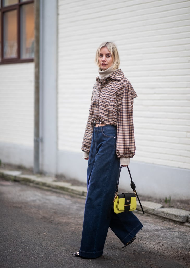 While it's still cool, try a cropped jacket with high-rise wide-leg jeans. A neon bag provides a Spring-y pop.