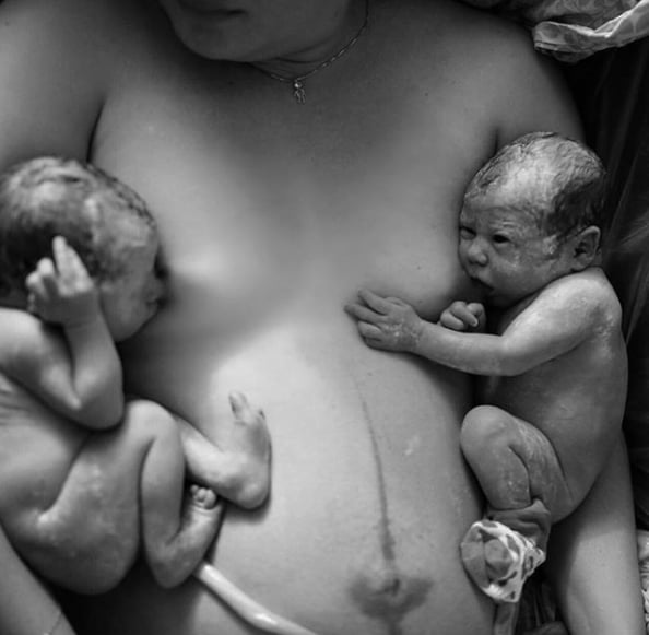 We love the unique perspective of these fresh twins getting their first latches on for a tandem breastfeeding session.