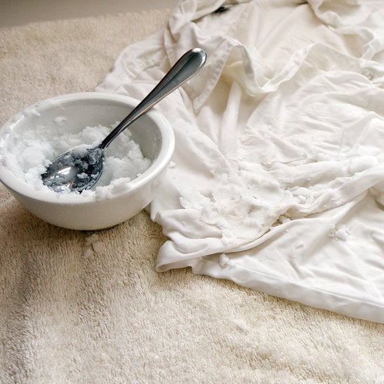 Mix together the baking soda, salt, and hydrogen peroxide until it forms a paste. Remove the shirt from the vinegar water and gently squeeze until the shirt is just damp. Lay flat on a towel-covered work surface and coat the stains with the mixture. Hydrogen peroxide is a natural whitening agent, and baking soda and salt work together to lift the stain. Let sit for at least 20 minutes.
