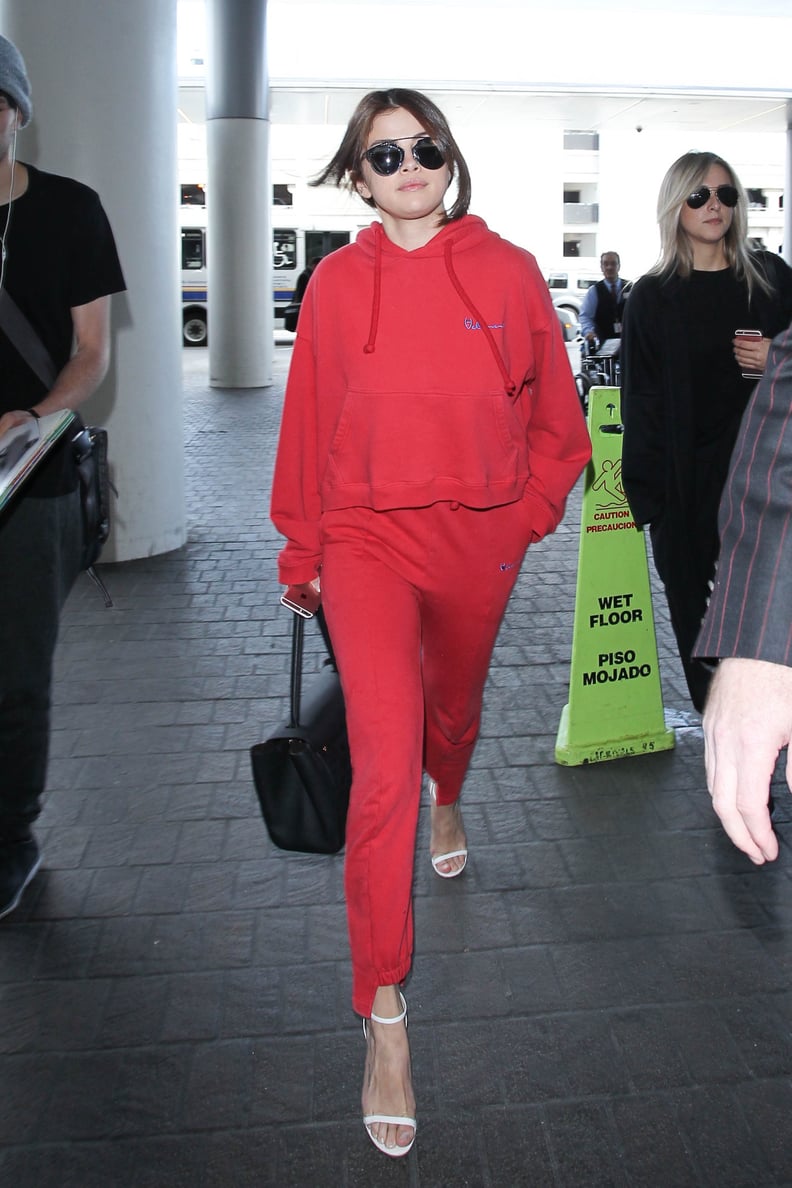 Selena Walked Through the Airport in a Sweatsuit and Heels