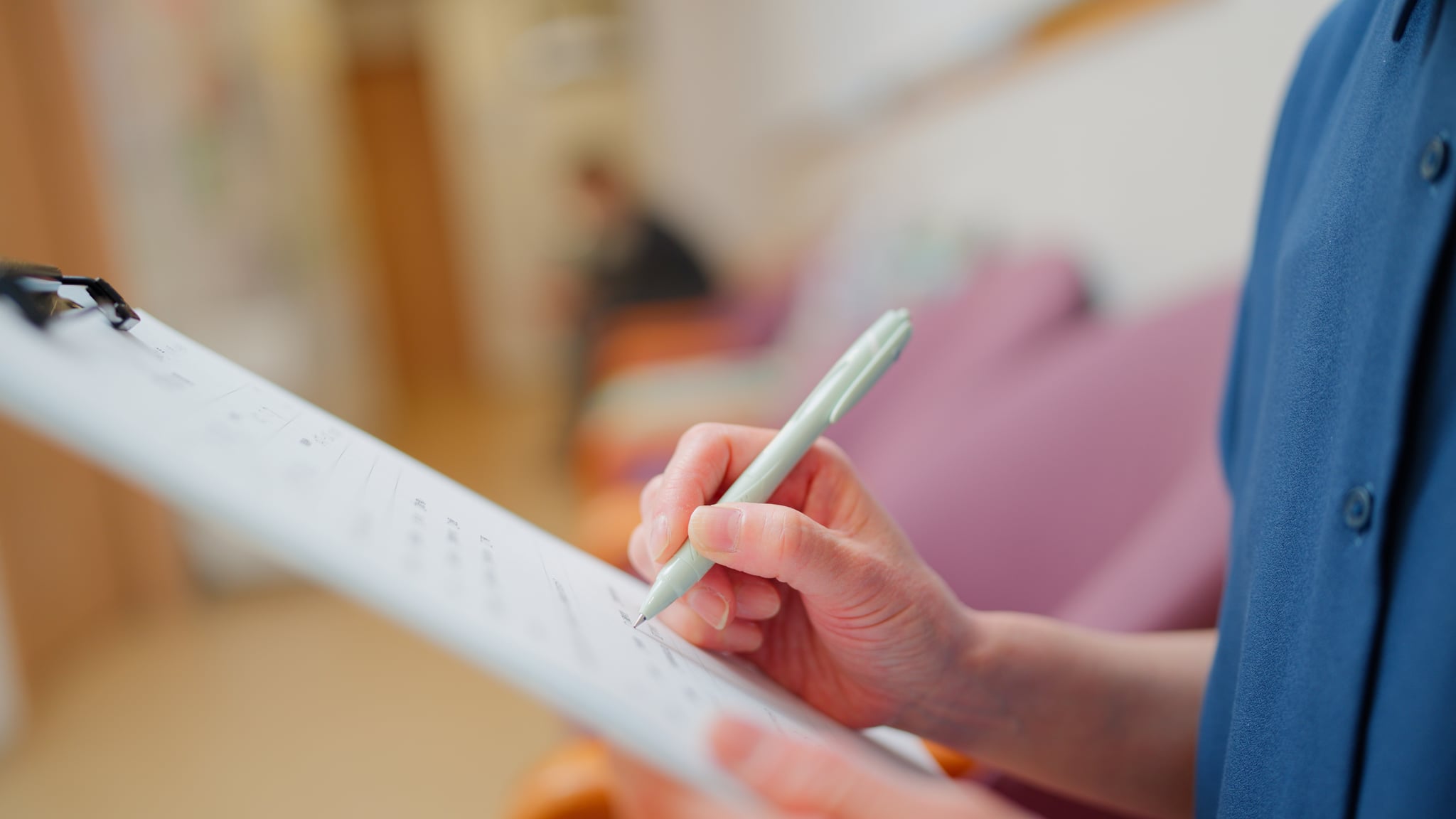 Female patient filling out medical questionnaire