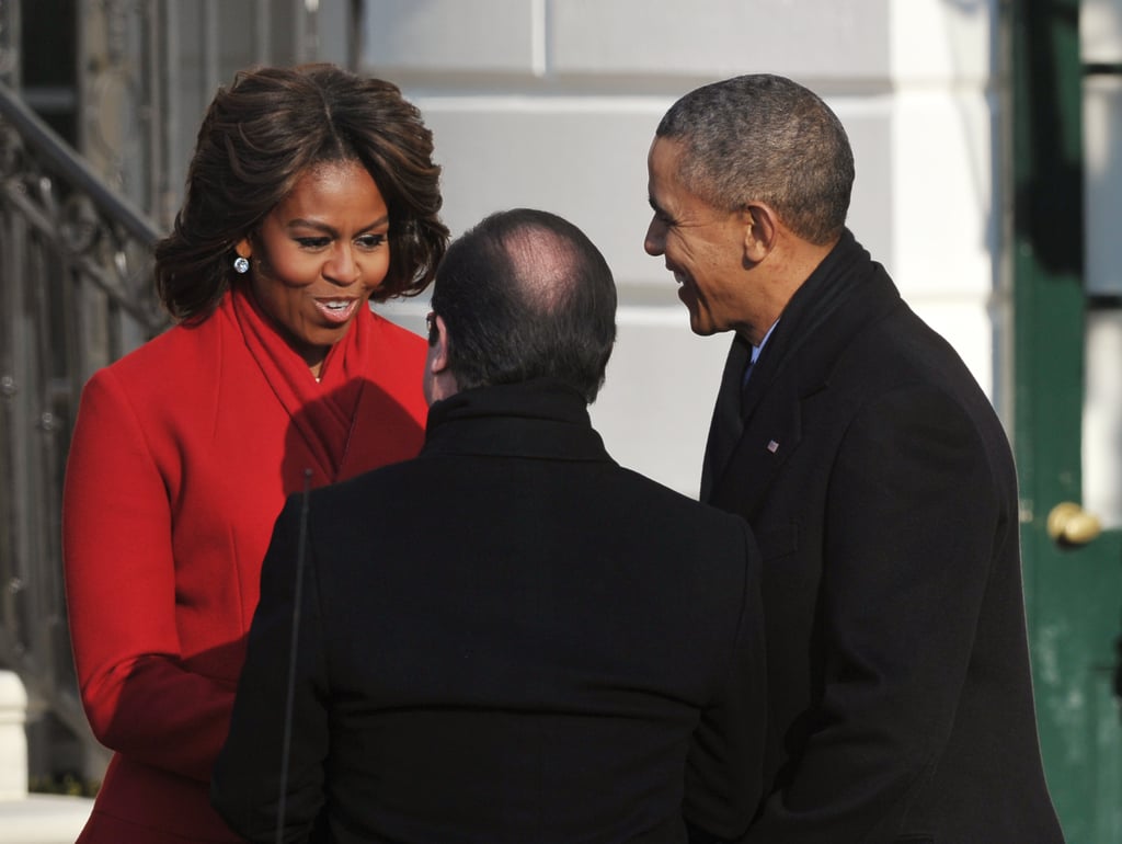 Michelle charmed them when they arrived, looking flawless in red.