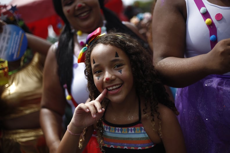 RIO DE JANEIRO, BRAZIL - FEBRUARY 16: A kid smiles at Bloco da Preta in downtown Rio on February 16, 2020 in Rio de Janeiro, Brazil. (Photo by Wagner Meier/Getty Images)