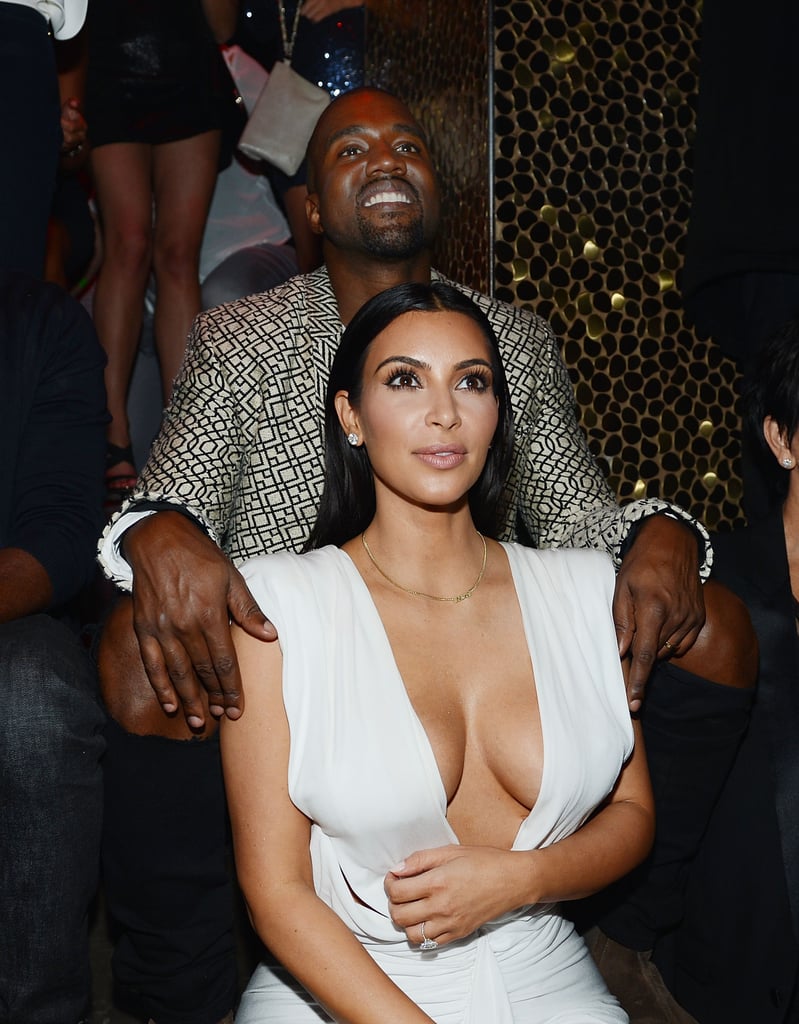 Kanye doted on Kim at the nightclub.