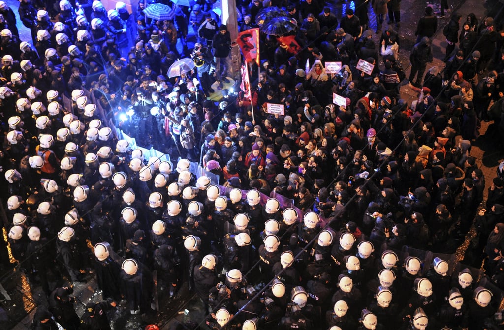 In Turkey, marching women met with a barricade of police officers.