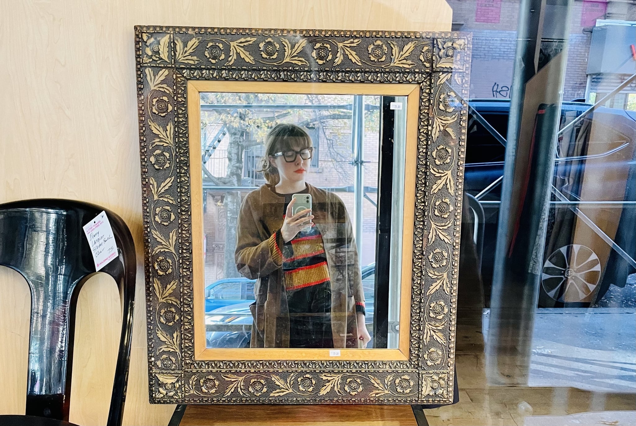 editor takes a creative mirror selfie of a dopamine dressing outfit