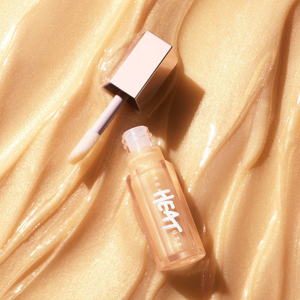 Gold Lip Gloss: Fenty Beauty Gloss Bomb Heat Universal Lip Luminiser + Plumper in Lemon Lava