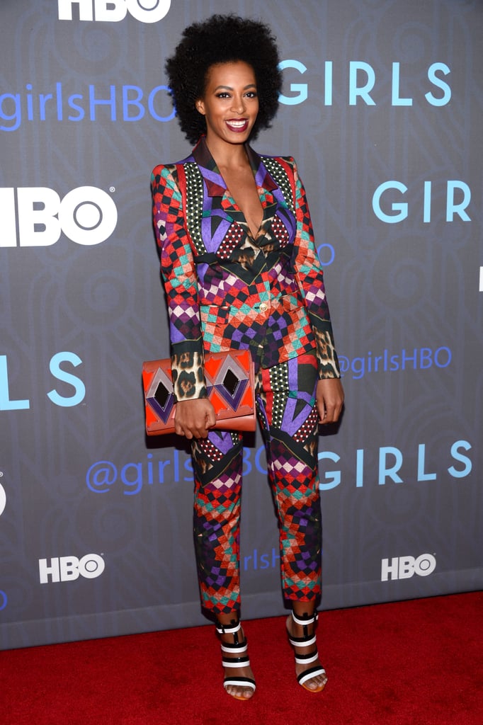 In signature Solange fashion, the singer wowed in a geometric-print Just Cavalli suit, black-and-white Bottega Veneta sandals, and a coordinating colorful clutch at the season-two premiere of Girls in NYC.