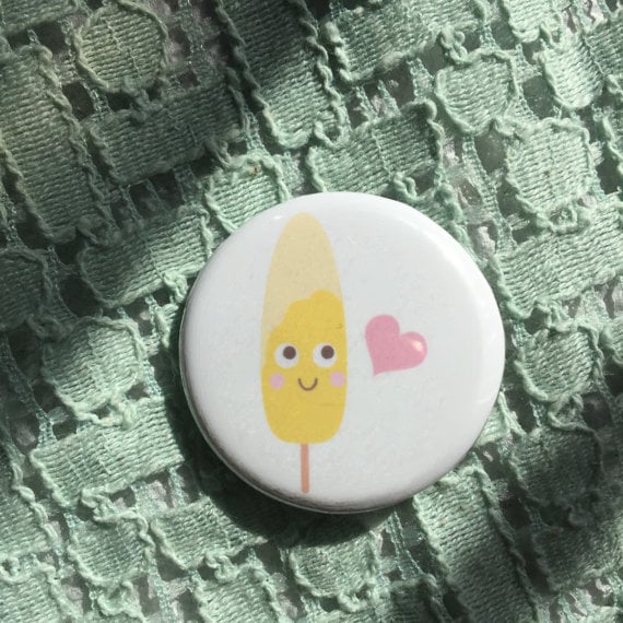 We're obsessing over this button right now.
Elote Corn on a Stick Button ($3)