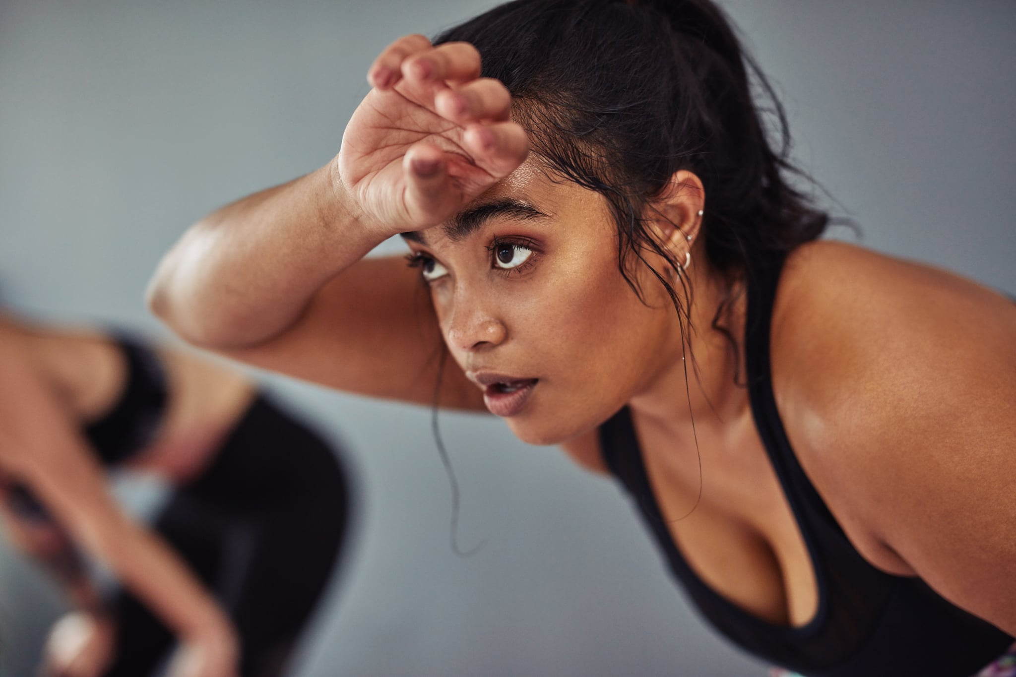 Shot of a young woman taking a break from her workout at the gym