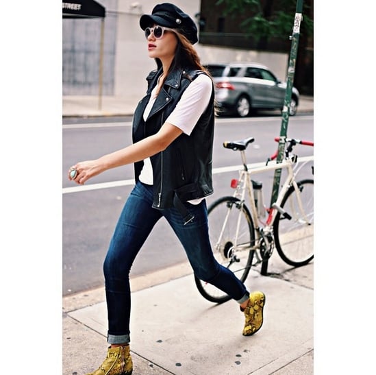 A Breton cap contrasts with the biker appeal of a motorcycle vest and edgy snakeskin booties. Jeans and a white tee are the only neutralizers in this outfit.
Source: Instagram user natalieoffduty