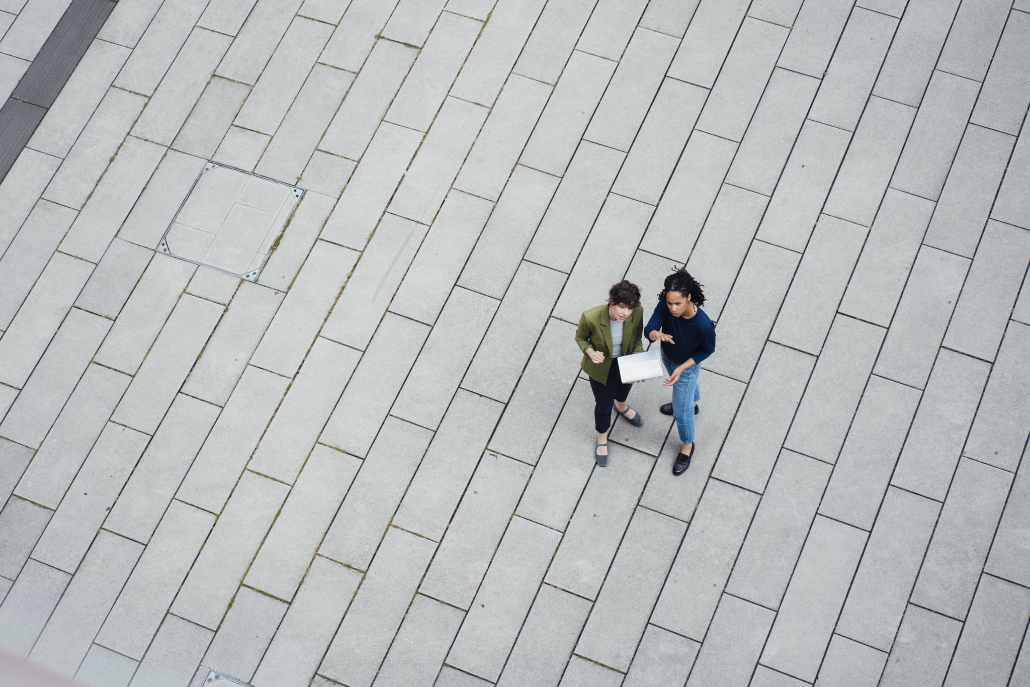 colleagues talking in a courtyard