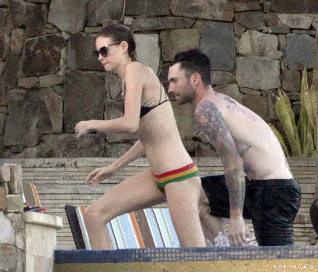 Behati Prinsloo and Adam Levine hung out in the pool during their vacation in Mexico.