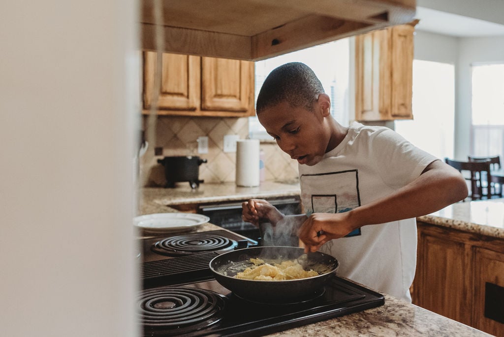 "Adrian hopes to one day be a professional baker. His other goals include trying to eat a whole pizza by himself and traveling the world. He describes himself as a 'chowing down machine' because he loves to eat. He also enjoys looking for cool rocks, building things, and playing basketball."