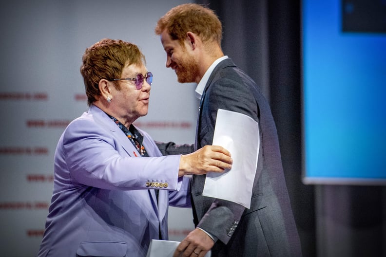 British Prince Harry (L) and sir Elton John attend a session about the Elton John Aids Fund on the second day of the Aids2018 conference, in Amsterdam on July 24, 2018. - From 23 to July 27, thousands of delegates -- researchers, campaigners, activists an