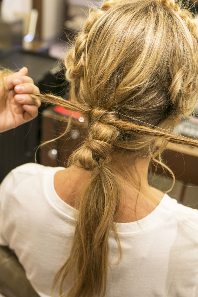 Tie the two ends into a knot around the top of the ponytail base.