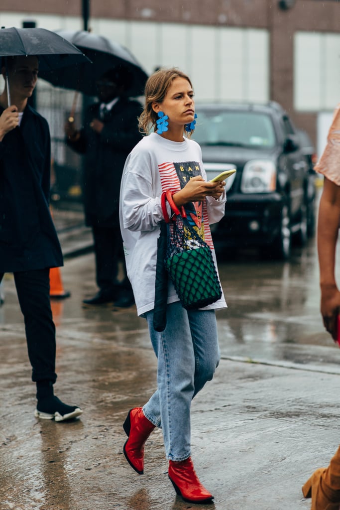 Style a sweatshirt and jeans with the coolest earrings, boots, and bag.