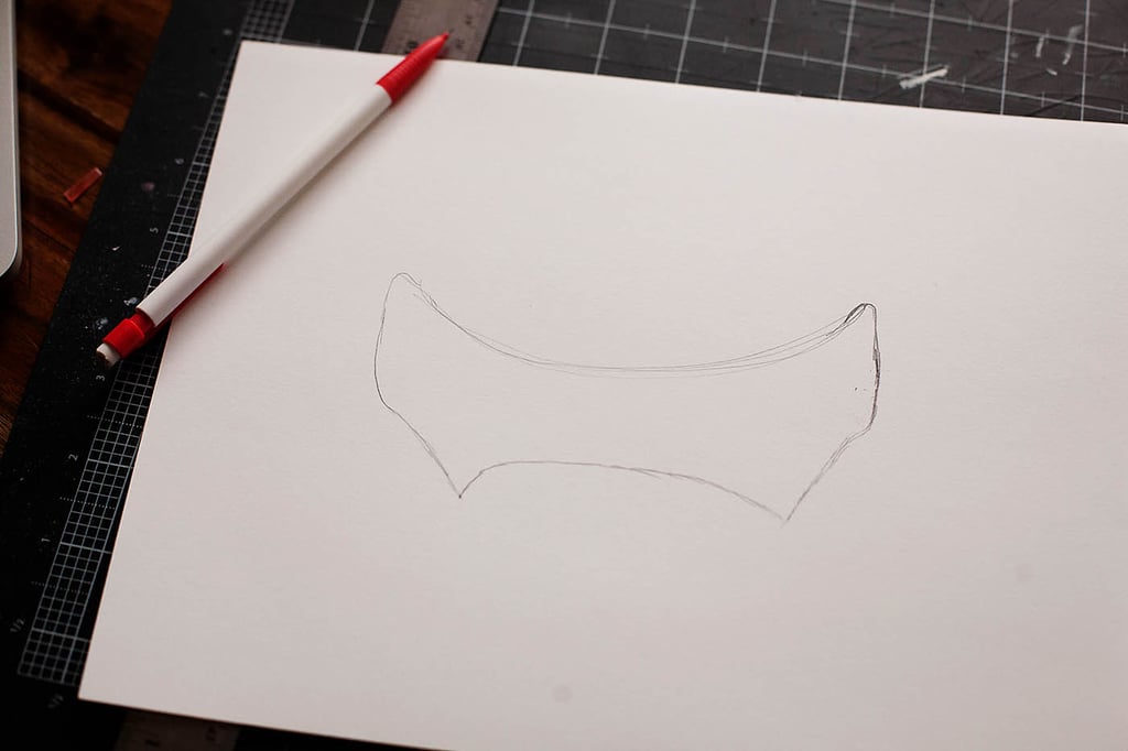 Next, we're making the eye cutout: just trace the shape on a piece of white card stock and cut out.