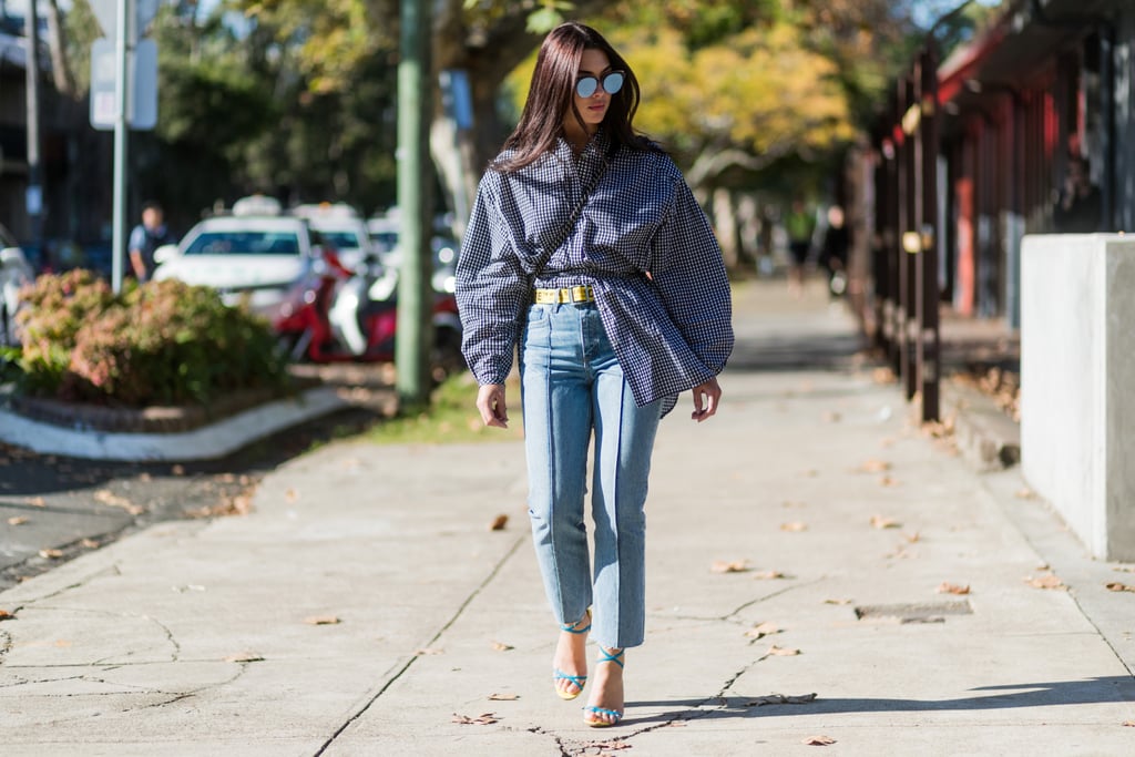 Let one peek out from a must-have gingham top and jeans combination.