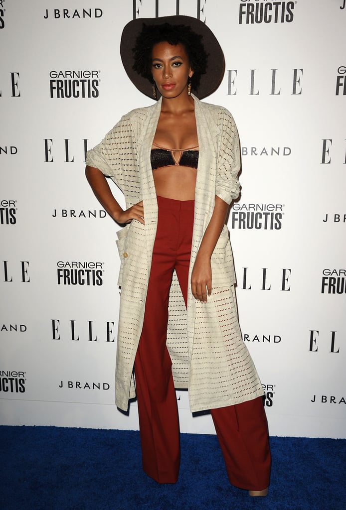 Sexy and funky: that's Solange's specialty. She sported high-waisted trousers in a flattering shade of red, paired with a pretty black bandeau and full-length knit sweater — making for a hot, bohemian-chic red-carpet look at the 2011 Elle Women in Music event in Hollywood.