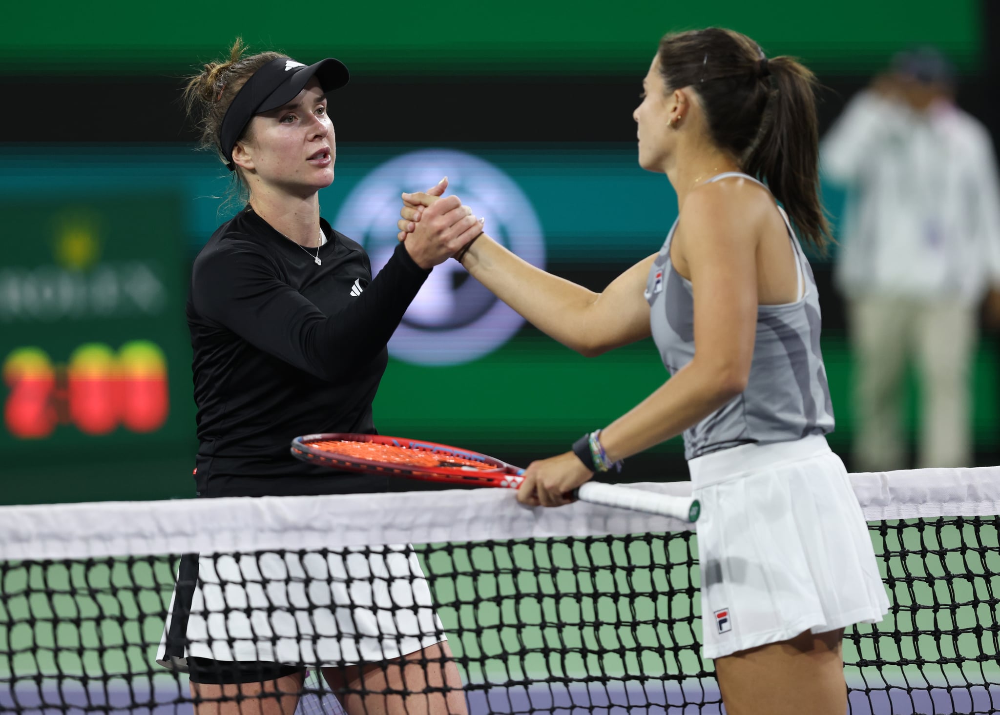 INDIAN WELLS, CALIFORNIA - MARCH 11:  Emma Navarro of the United States shakes hands at the net after her three set victory against Elina Svitolina of the Ukraine in their third round match during the BNP Paribas Open at Indian Wells Tennis Garden on March 11, 2024 in Indian Wells, California. (Photo by Clive Brunskill/Getty Images)