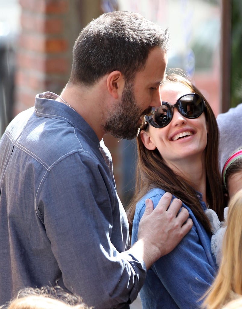 Ben put his hand on Jennifer's shoulder during a family outing in LA's Pacific Palisades neighborhood in March 2013
