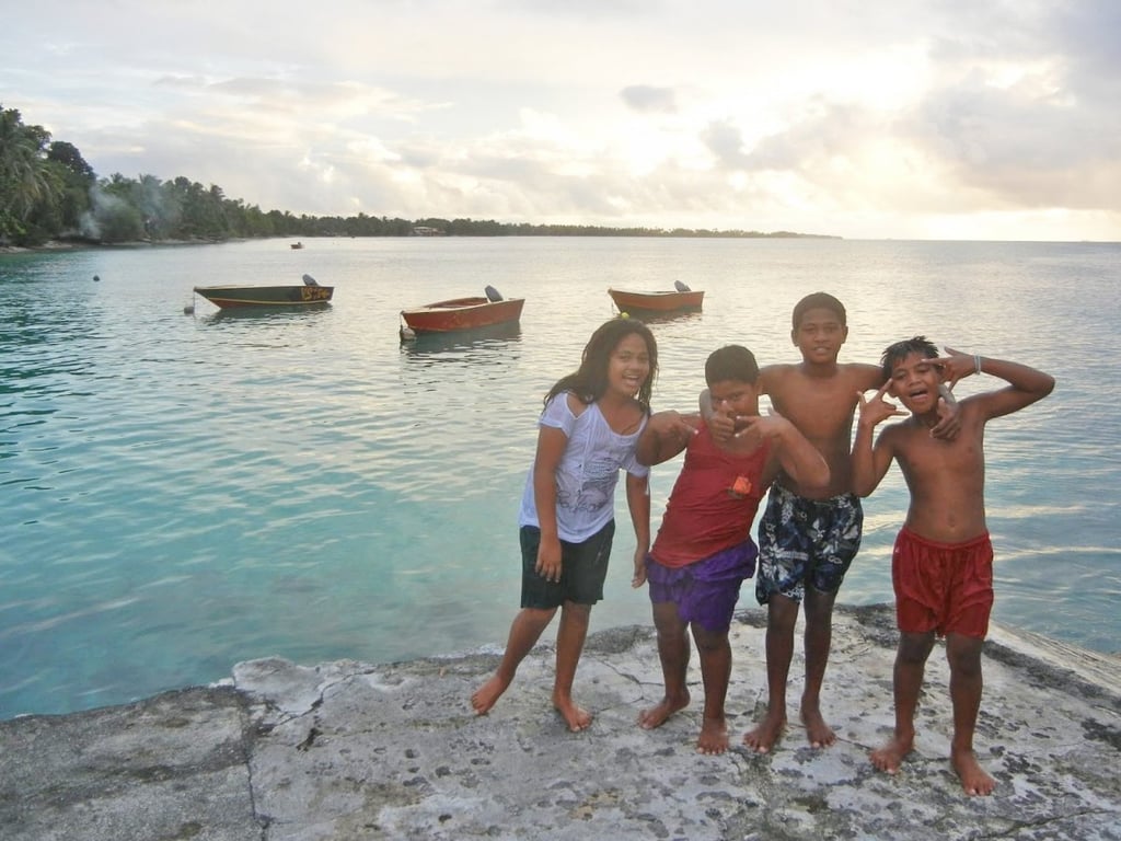 These children in Tuvalu, a Polynesian island between Hawaii and Australia, invited Garfors to go swimming with them. Garfors says Tuvalu will be the first country to disappear if ocean levels continue to increase.