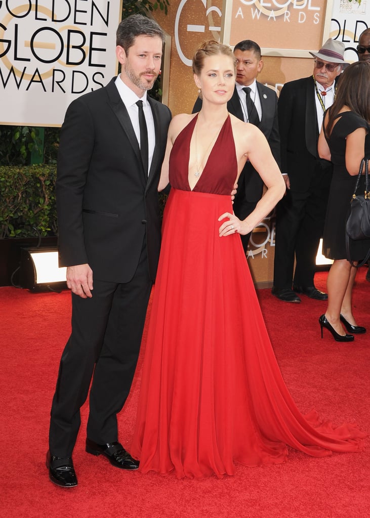 Amy Adams struck a pose alongside Darren Le Gallo at the Golden Globes.
