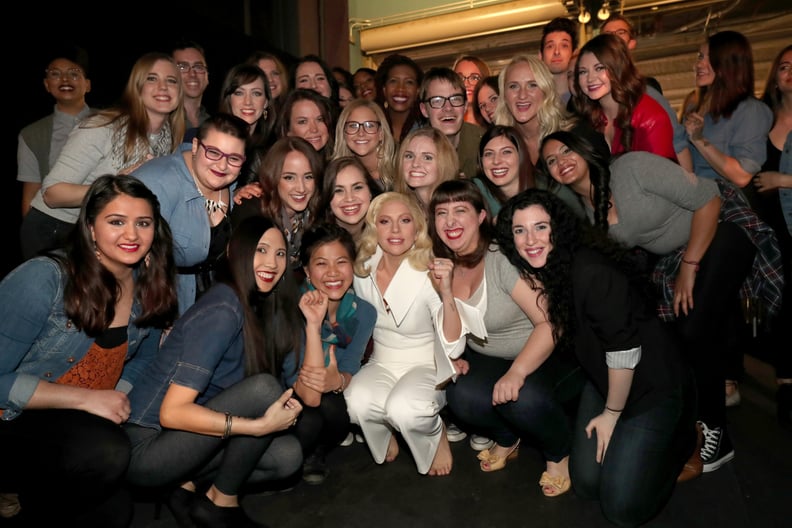 Lady Gaga posed backstage with the group of sexual abuse survivors who participated in her epic performance.