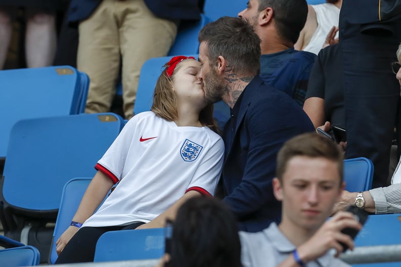 LE HAVRE, FRANCE - JUNE 27: David Beckham kisses his daughter Harper Beckham during the 2019 FIFA Women's World Cup France Quarter Final match between Norway and England at Stade Oceane on June 27, 2019 in Le Havre, France. (Photo by Catherine Steenkeste/