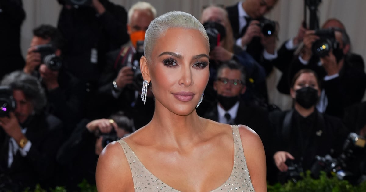 Watch Kim Kardashian Battle to Climb Stairs in Tight Gown