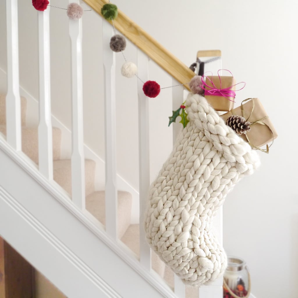 With the popularity of chunky knits on throw blankets and accent pillows, it was only a matter of time before Knitted Christmas Stockings ($82) embraced the cozy style too.