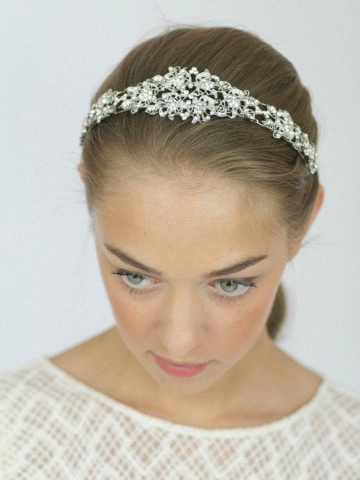 Made with vintage-inspired crystals, rhinestones, and pearls, this piece is definitely a statement bridal headband ($75).